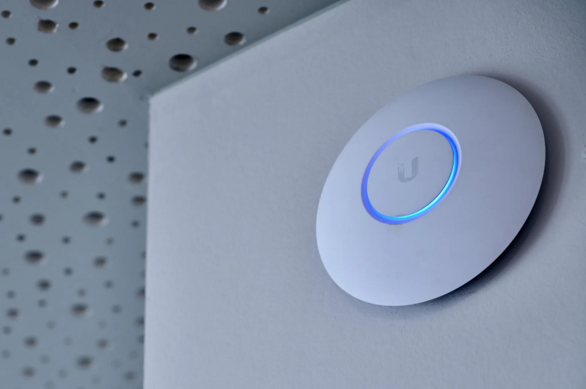 Professional wireless access point installed on a workplace ceiling