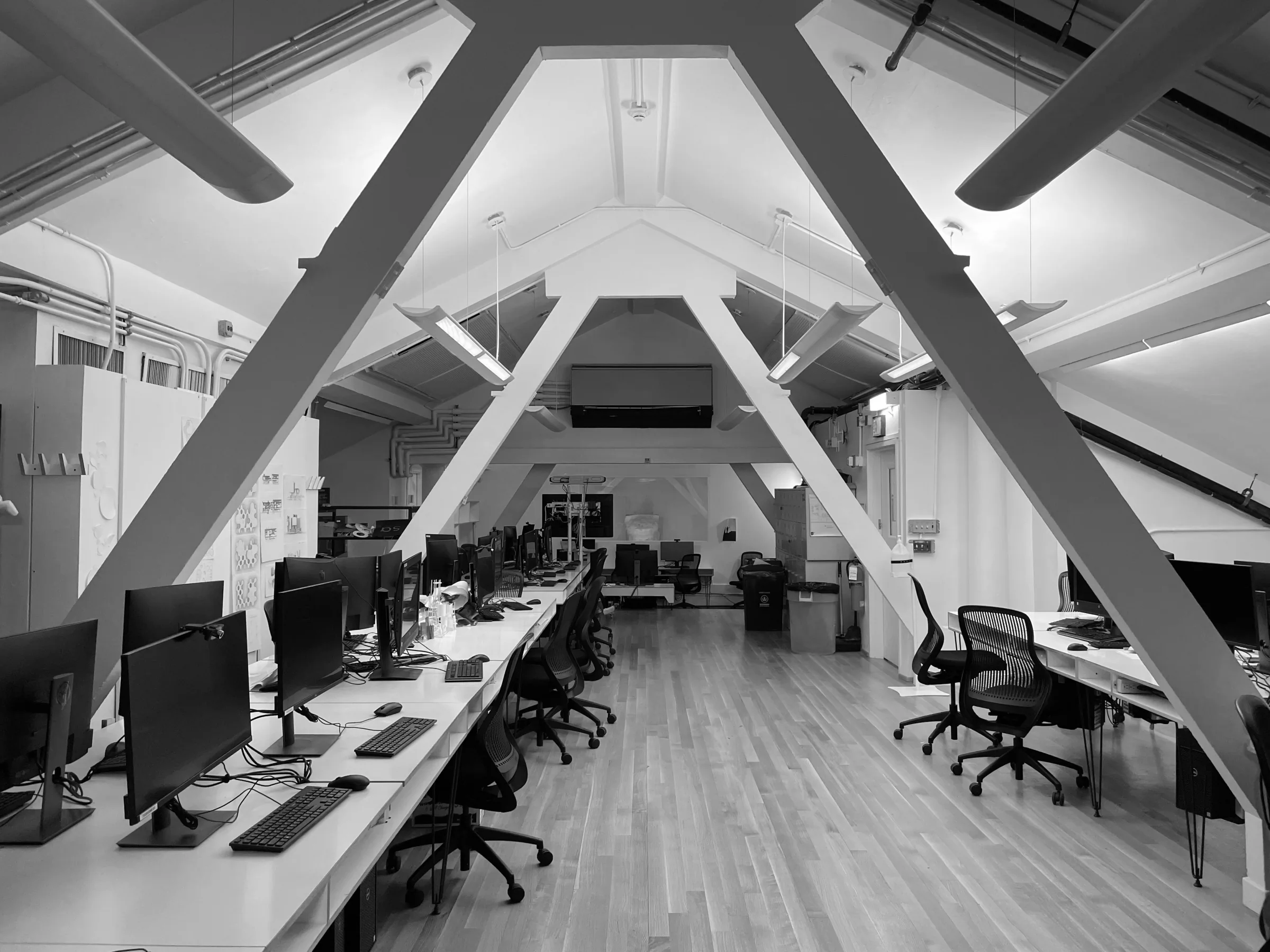Professionally arranged small office with configured workstations